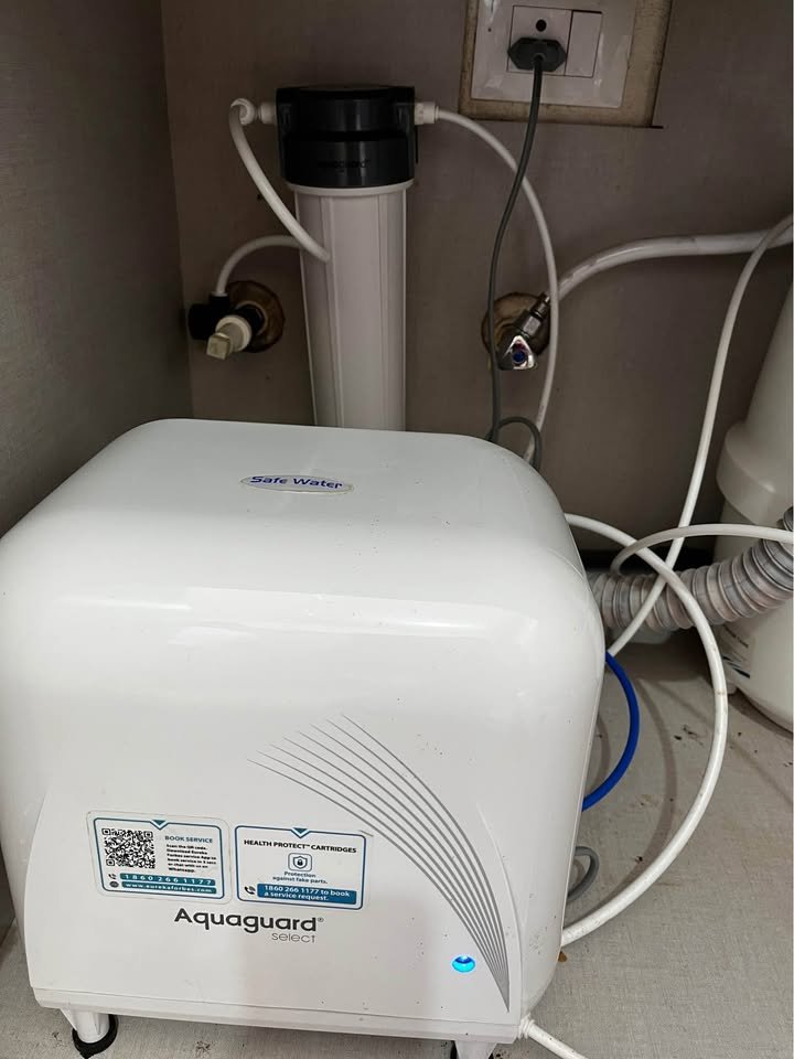 Aquaguard ENRICH Select Designo Copper RO water purifier installed under a kitchen sink