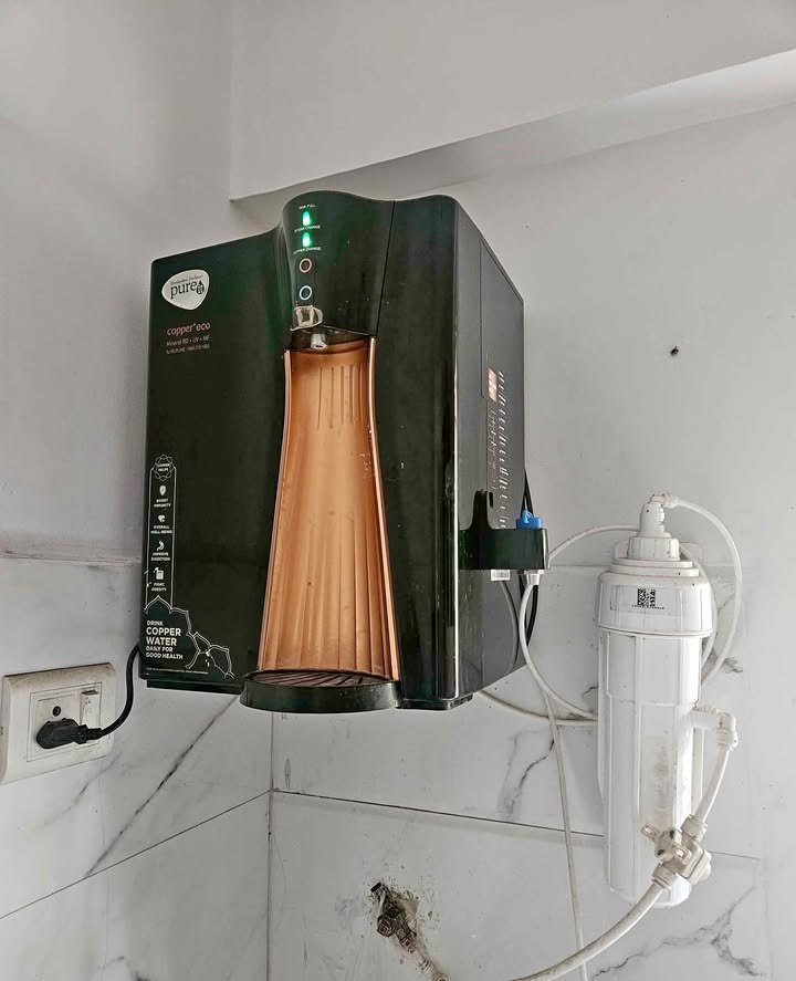 HUL Pureit Copper+ Eco RO UV MF water purifier with bottle tray, water dispensing faucet and purifying status indicator